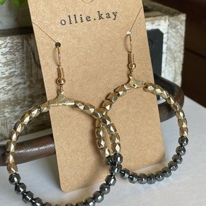 Gold and black hoop earrings